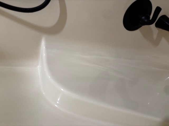 Sparkling clean bathtub, before and after transformation